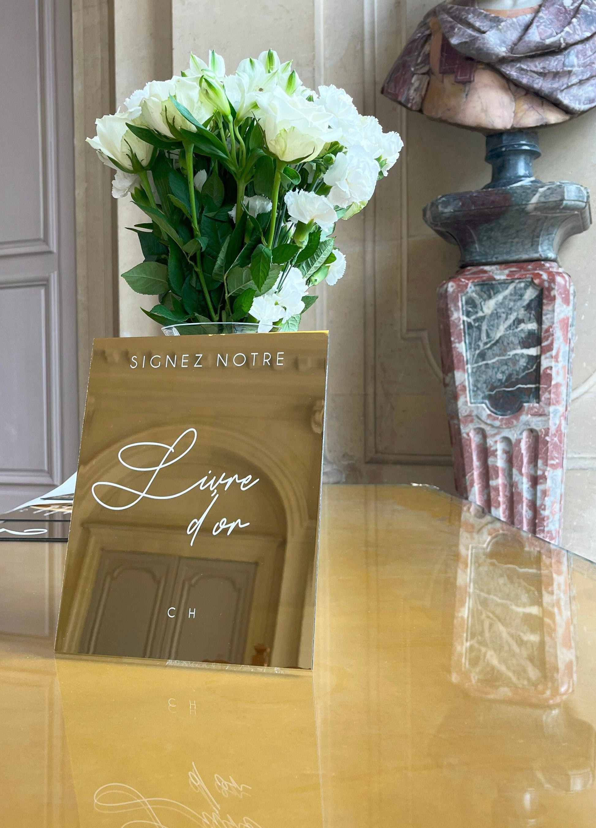 Panneau en miroir doré avec inscription calligraphique pour le livre d'or